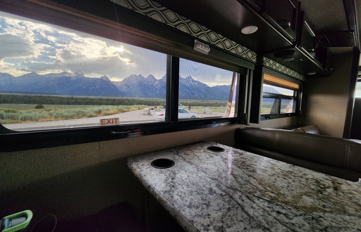 Dining and living room window views of Grand Teton mountains