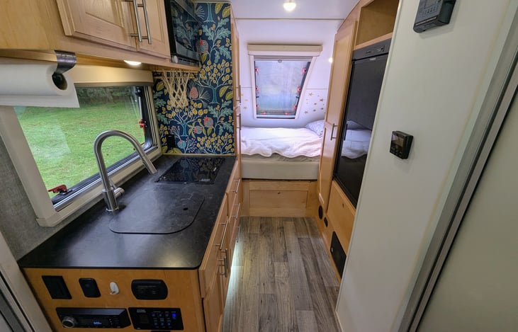 Solid cabinetry and pop-out windows throughout make this interior classy, bright and accommodating. Ample storage and everything you will need to enjoy your experience.