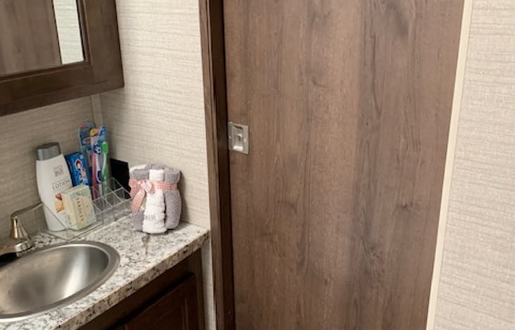 Door between bathroom and queen bedroom closed and can be locked or kept open.