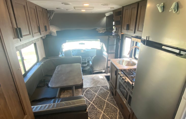 Kitchen/Dining and large refrigerator.