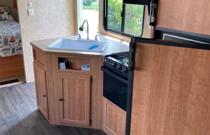 Kitchen with gas stove, kitchen sink, refrigerator, freezer & microwave!