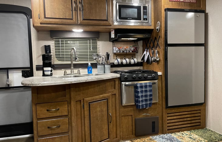 Keurig coffee maker, stove, microwave and refrigerator