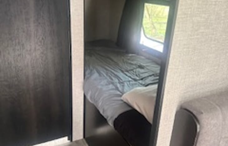 Two bunks in the bunk area, there is a ladder that will be placed in the camper to help access the top bunk easier!
