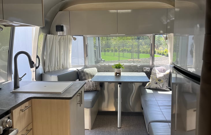Dining table is at the back of the trailer so you always  have a view when backed into your space. It converts into a twin size bed