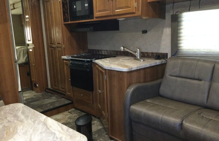 Full size kitchen with sliding pantry doors