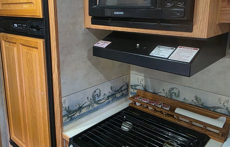 Microwave, Propane Stove, Propane/Electric Fridge & Freezer