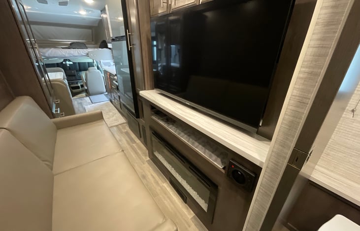 Great  entertainment center with fire place and stereo