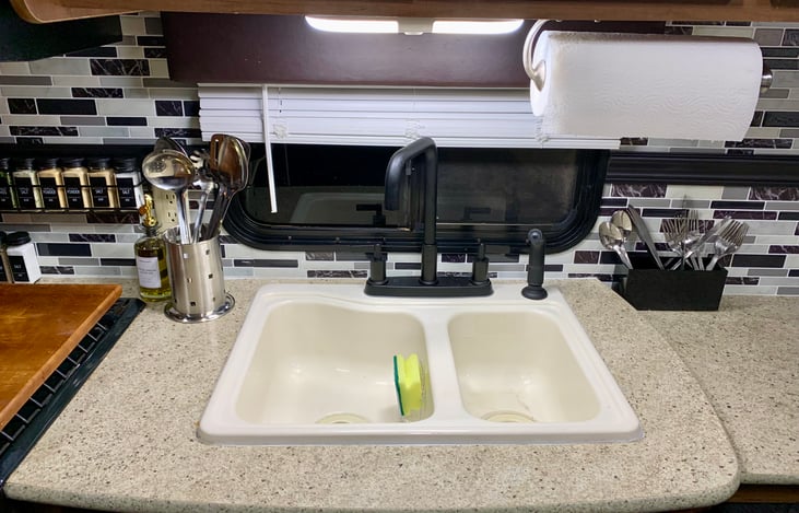 Upgraded kitchen faucet with eating utensils pictured