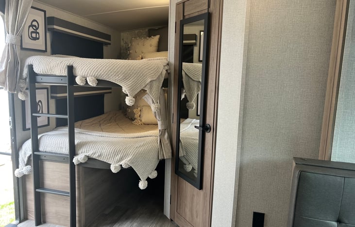 Storage under full size bunk beds. Full length mirror on door to full bath.