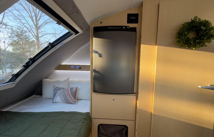 The fridge will always keep your groceries and beverages ice cold whether plugged into 30-amp shore power or battery power sourced from the built-in solar panel on the roof.