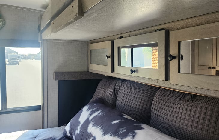 Private King bedroom with closets and drawer space.  Tv in cabinet when plugged into shore power or running a generator