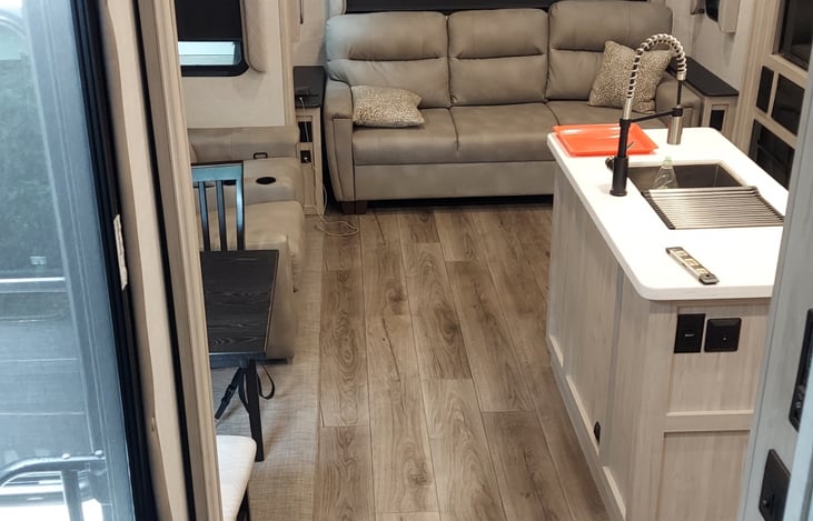 TRAILER KING SIZE, TRI FOLD COUCH .COMES WITH A PURPLE MATRESS FOAM COVER TO MAKE IT EXTRA CONFORTABLE.