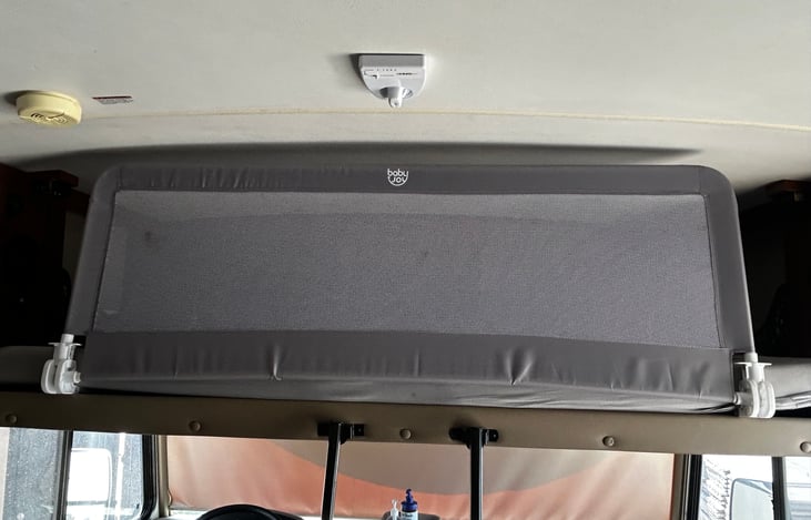Removable safety net for safety on overhead bunk.