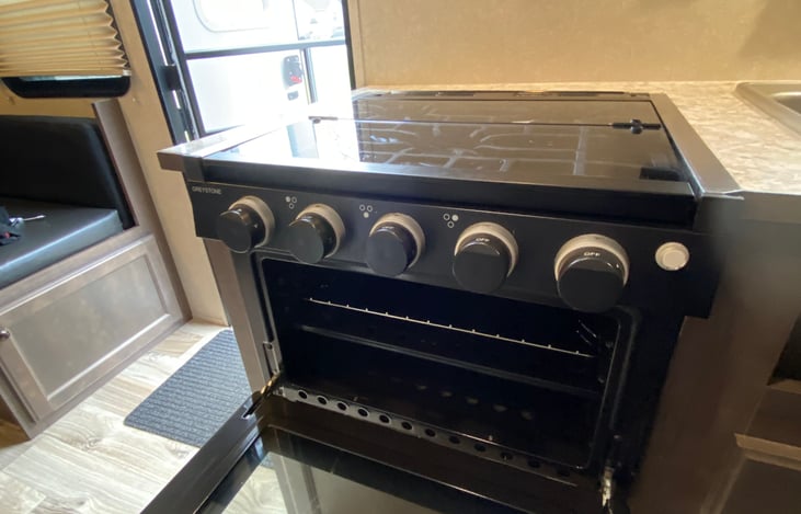 Kitchen: glass oven covered range with open oven