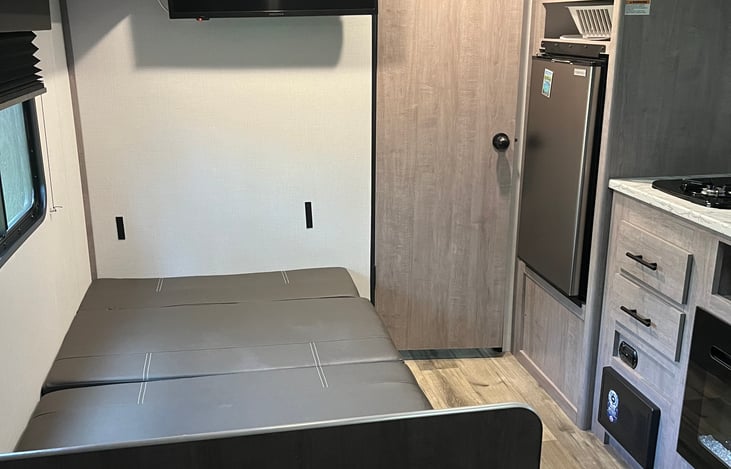 Dinette table turns into bed.