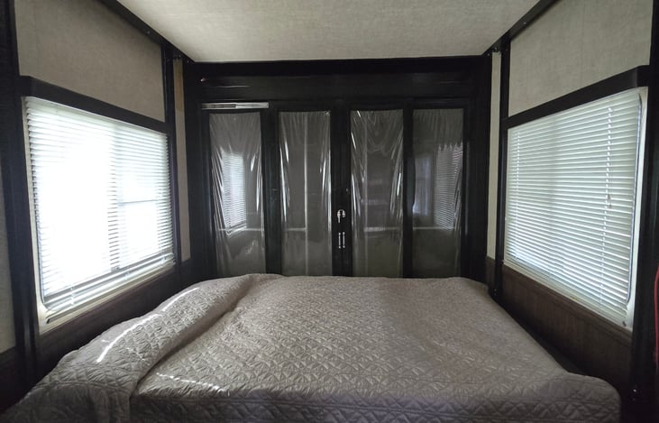 Rear queen bunks. The other queen  electronically lowers from above if needed.