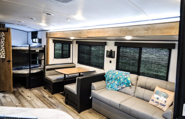 Double bunks both have a closing curtain for privacy and a ladder for easy access.