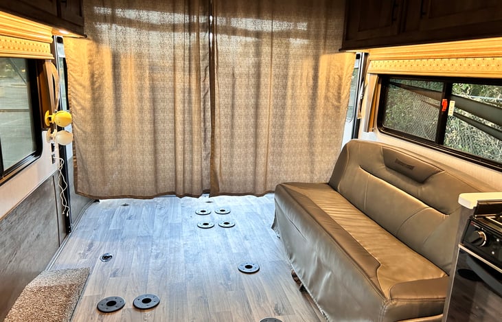 Couch in common area; lays flat as a bed at night. Bedding not included for sofa beds.