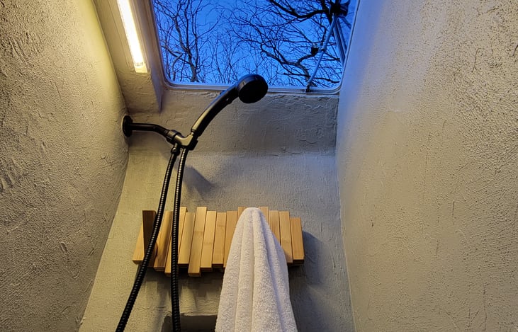 Boat hatch roof above shower