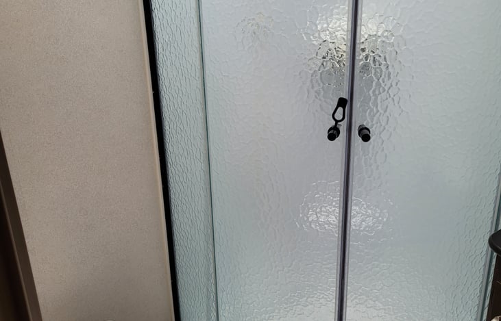 Shower with glass enclosure