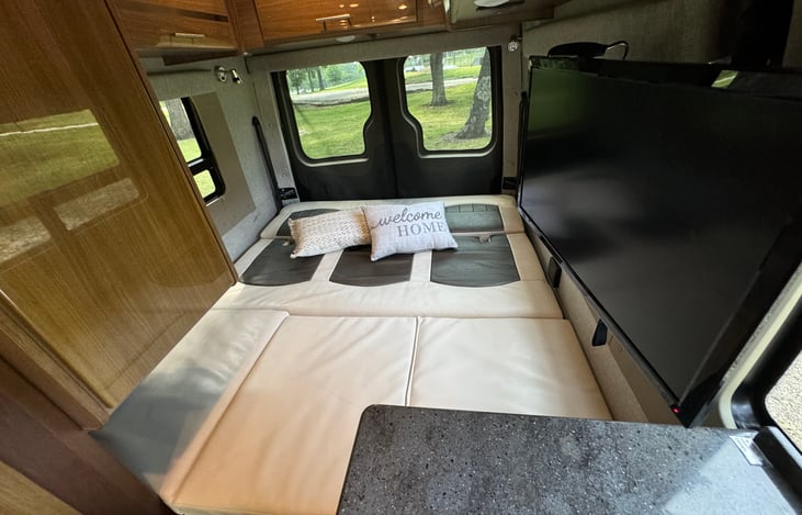 Power fold out couch turns into queen sized bed.