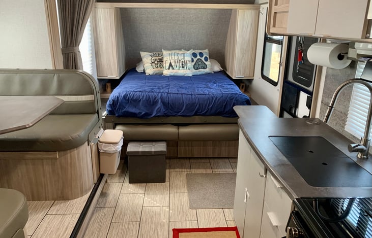 From back of trailer looking to the front. The bed is a Murphy Bed and folds up to create more space.