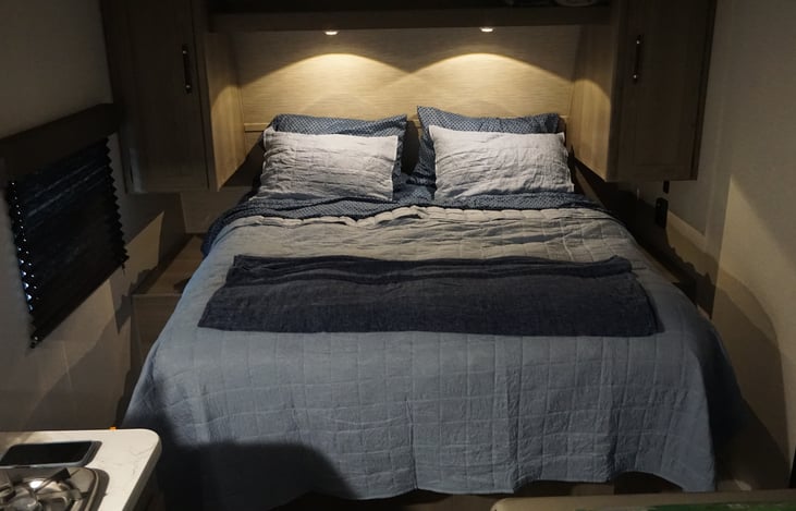Main bed space with individual overhead lights