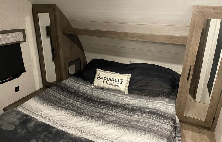 Separate queen bedroom with side closets and under bed storage