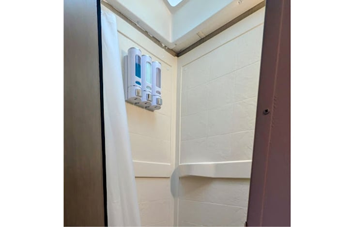 Shower (left side)
Shampoo, conditioner and body wash dispensers provided