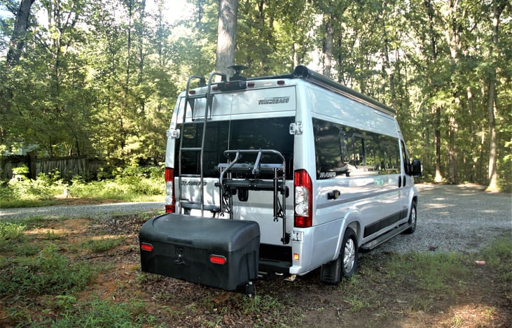 Back view showing extra storage bin, Bike rack, and Lader.