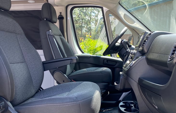 Comfy captains chairs with lots of storage and cup holders