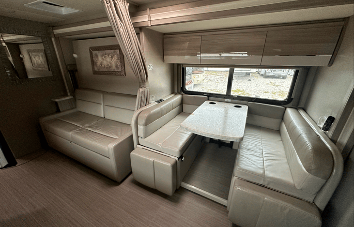 Nook with overhead storage, charging stations and lighting.  Nook can also be turned into a bed.  The sofa is storage for all the bedding and pillows.  Press a button and it becomes a queen size bed