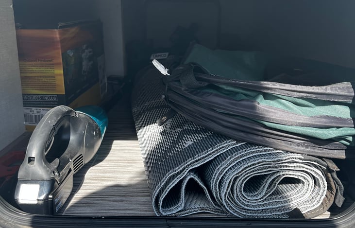 Large mat for outdoor comfort, cordless vacuum for your use. Lots of storage.