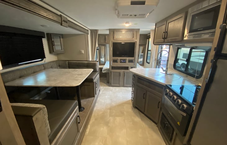 Spacious with rotating TV to watch from queen or dinette