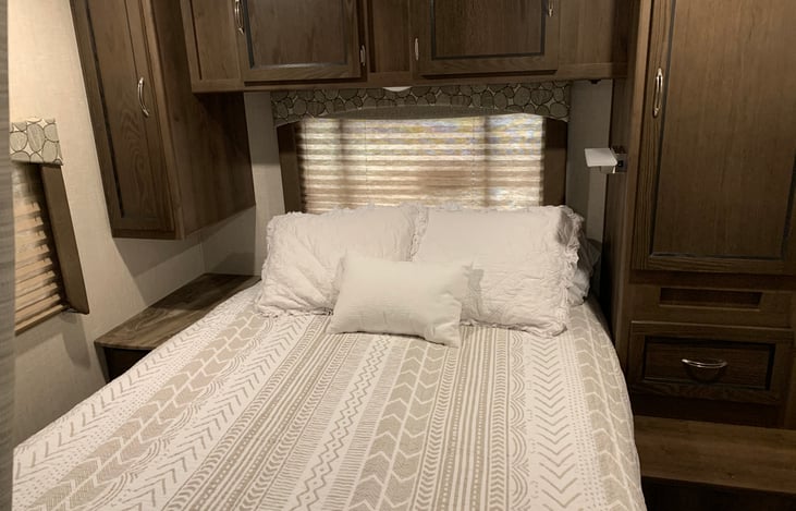 Walk around queen bed, with plenty of storage.