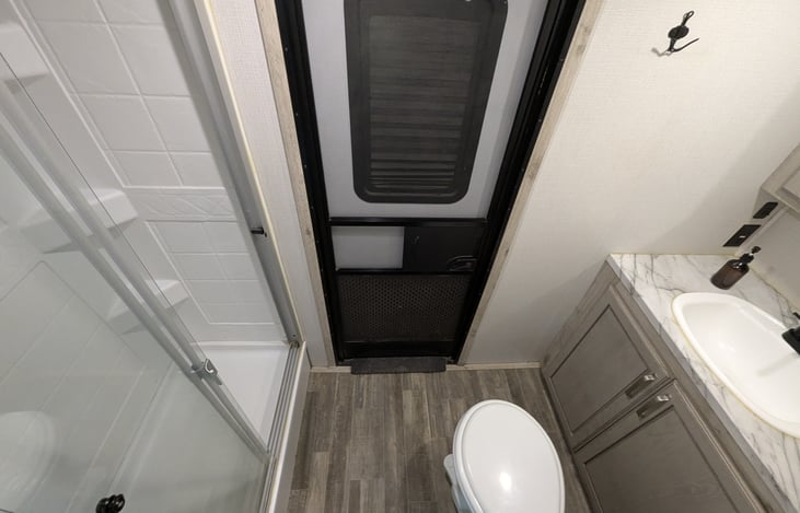 The ultimate guest retreat! This second master suite features a plush queen bed, massive wardrobe, and its own private full bathroom. Total privacy and comfort for friends or extended family.