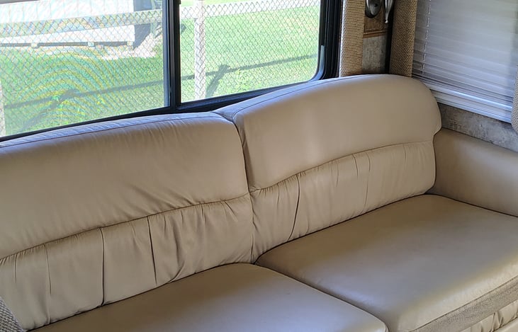 Leather sofa with with air assist Queen mattress.