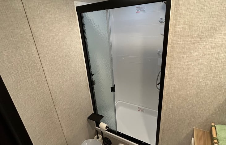 Roomy shower with adjustable shower head. Toiletries provided.