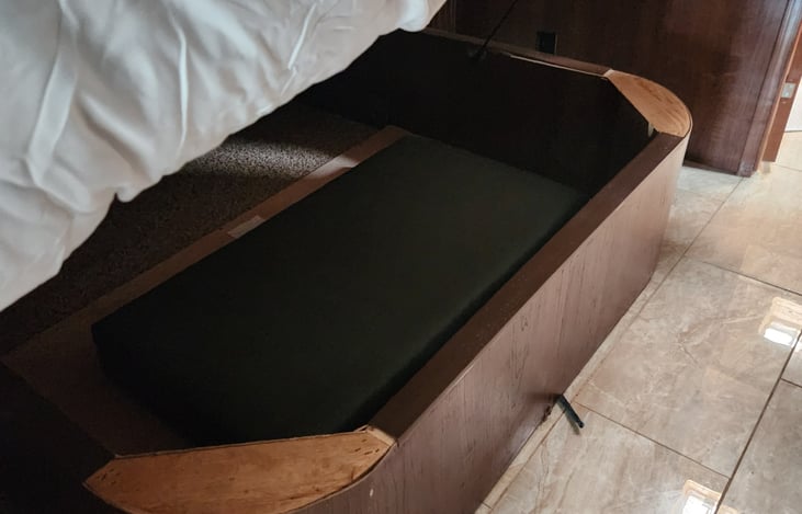Under bed storage with cushion for convertible twin bed.