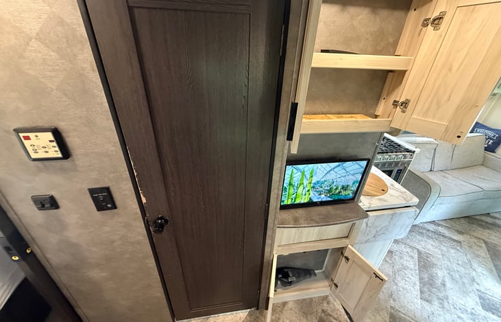Bathroom door and second TV that has HDMI input for gamers.