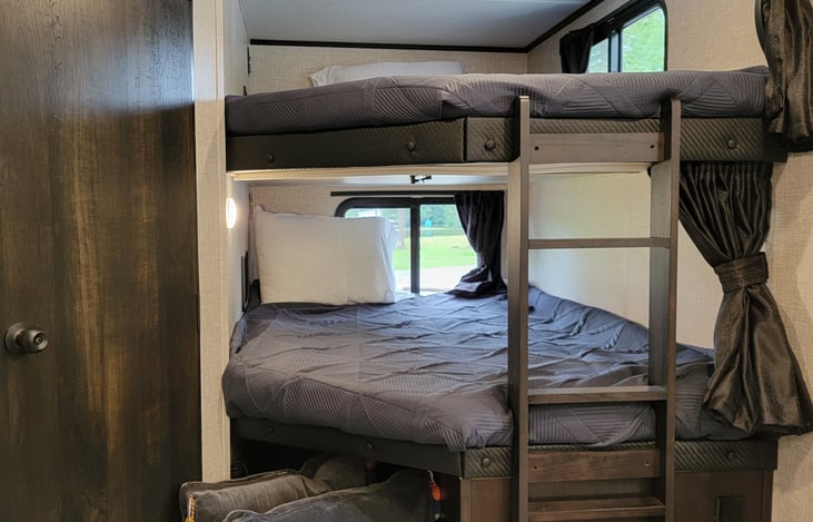 Double full size bunks with power and USB outlets for your devices!