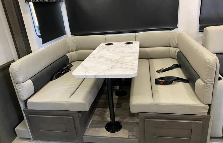 Dinette table seats 4 adults comfortable.