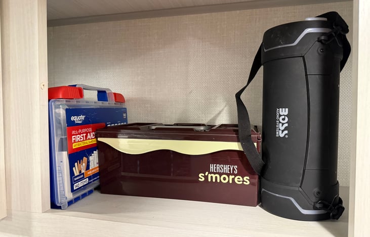 First aid kit, smore's kit and blue tooth radio.