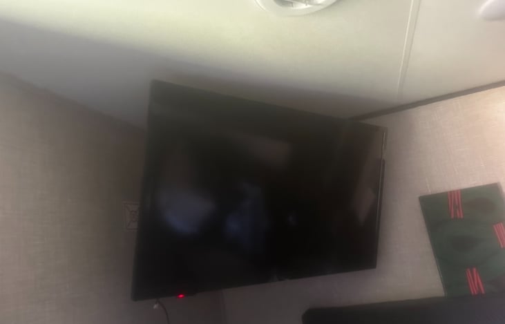 Wall mounted tv in the bedroom area!