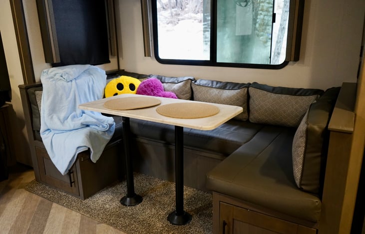 Living area. Kitchen table that turns into a bed. Fits one adult or two smaller persons.