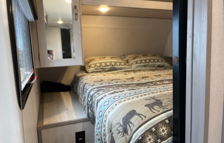 Master Bed with a closet area for plenty of clothes.