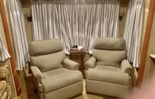 A 5th wheel travel trailer suited for 2 people