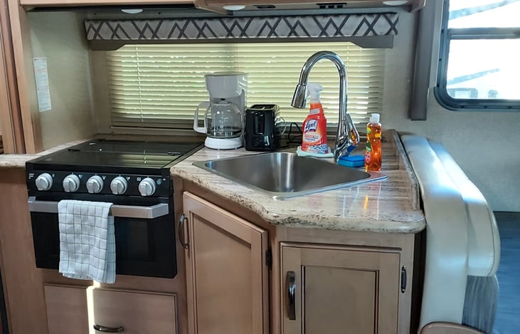 Kitchen with coffee maker and toaster.