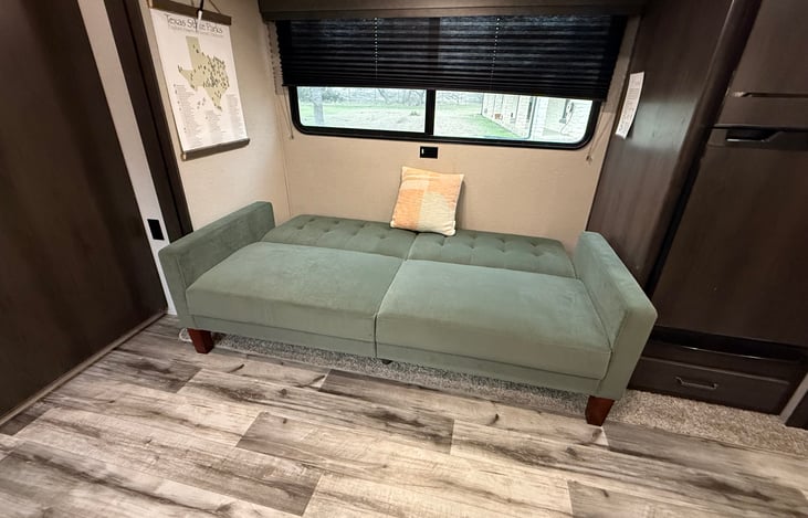 Couch converts to full bed in living room