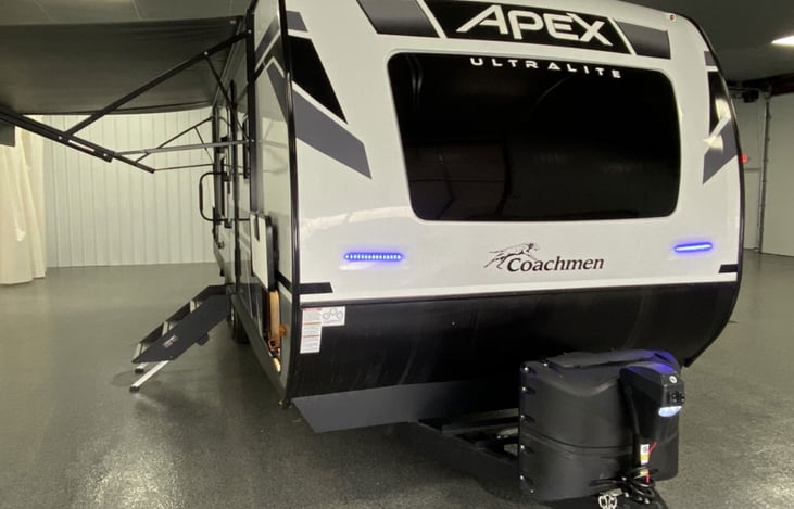 Front exterior view with brand logo, windshield and LED accent lights